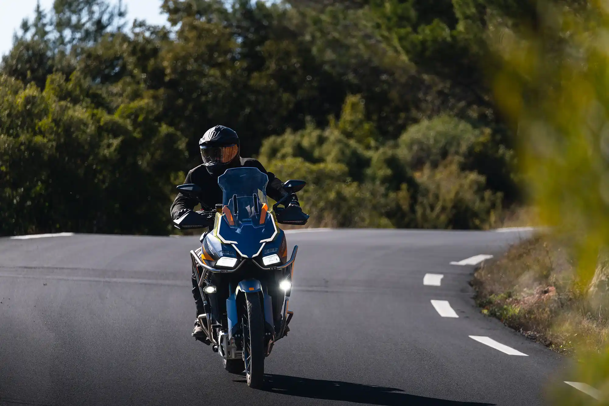 Zontes 703F rider on a winding road